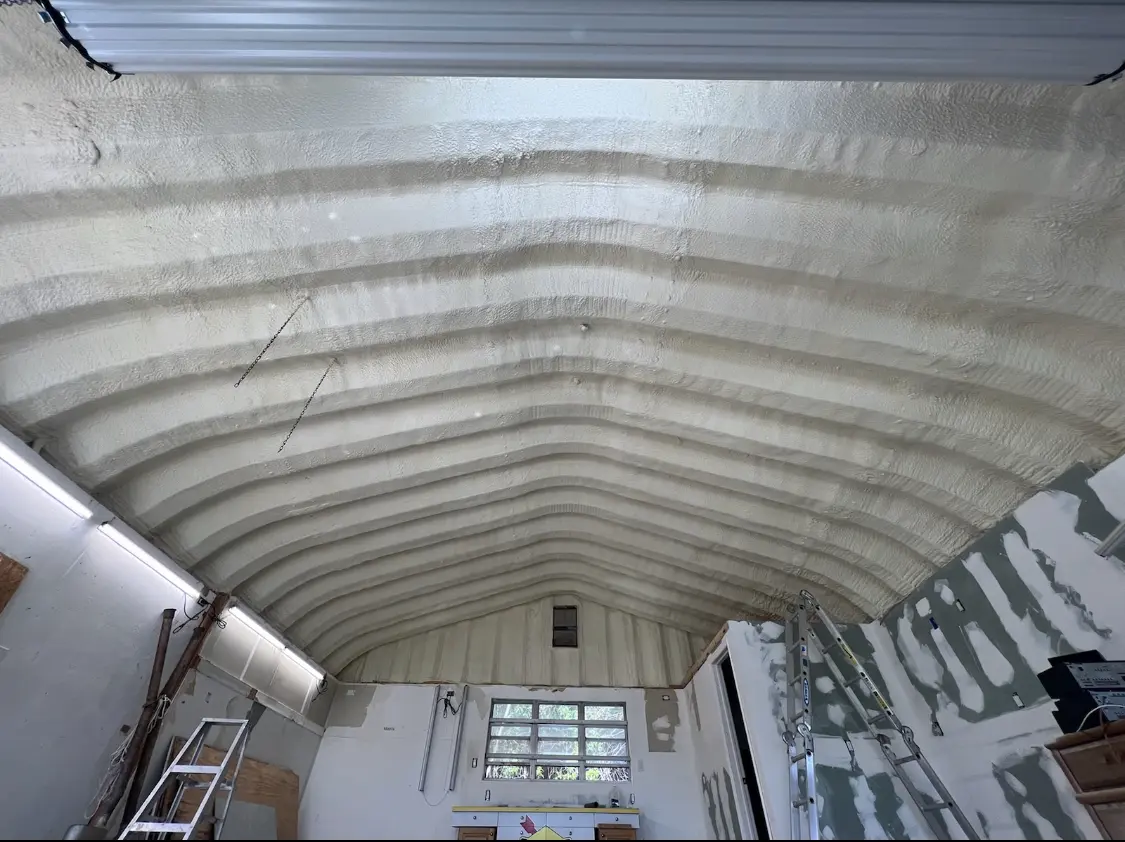 Spray polyurethane foam applied to the underside of a metal roof deck in Temecula
